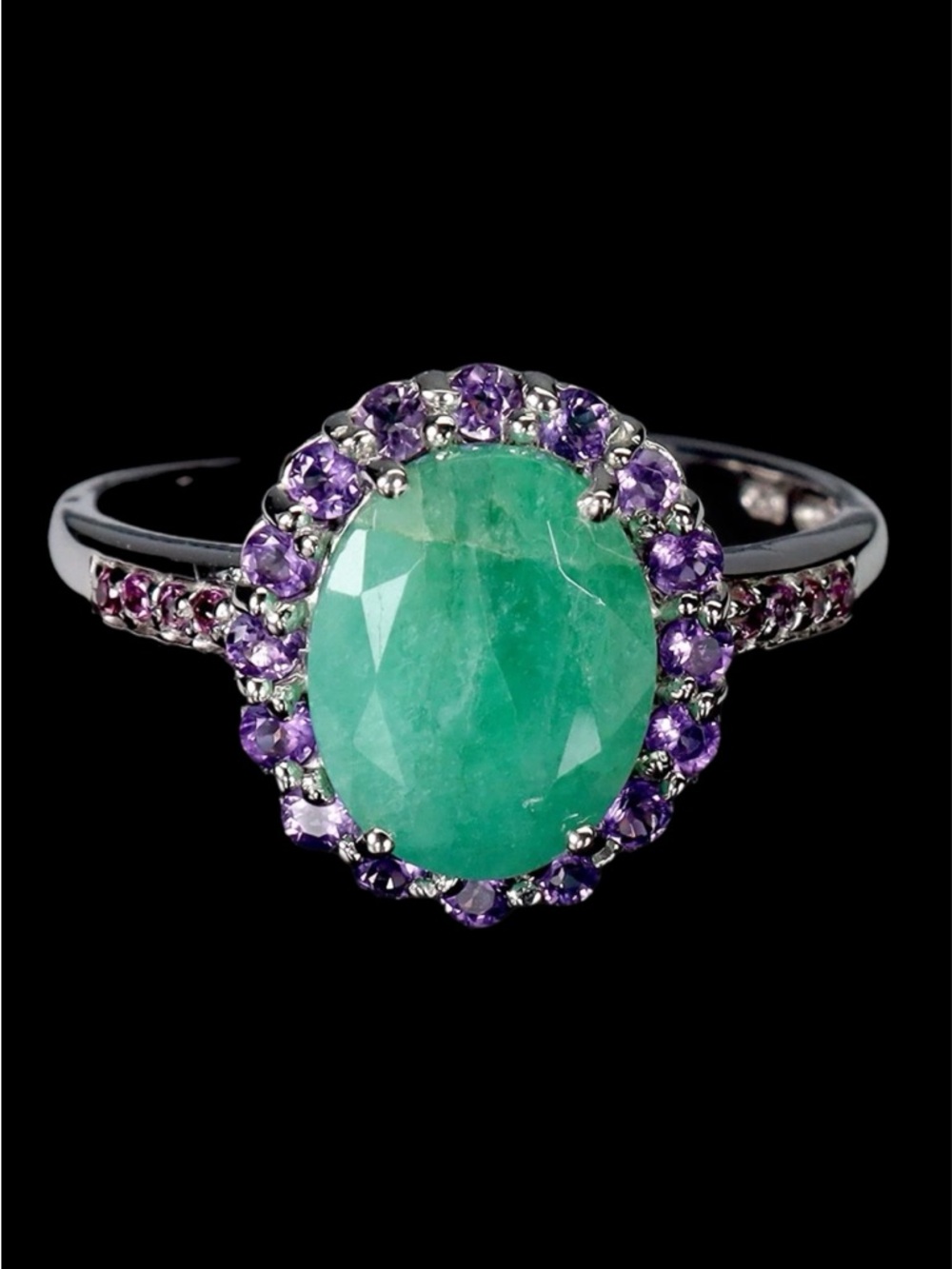 Genuine 8 mm by 10mm Emerald- Halo Ring with Genuine Amethysts
See Video - Picture 6 of 7